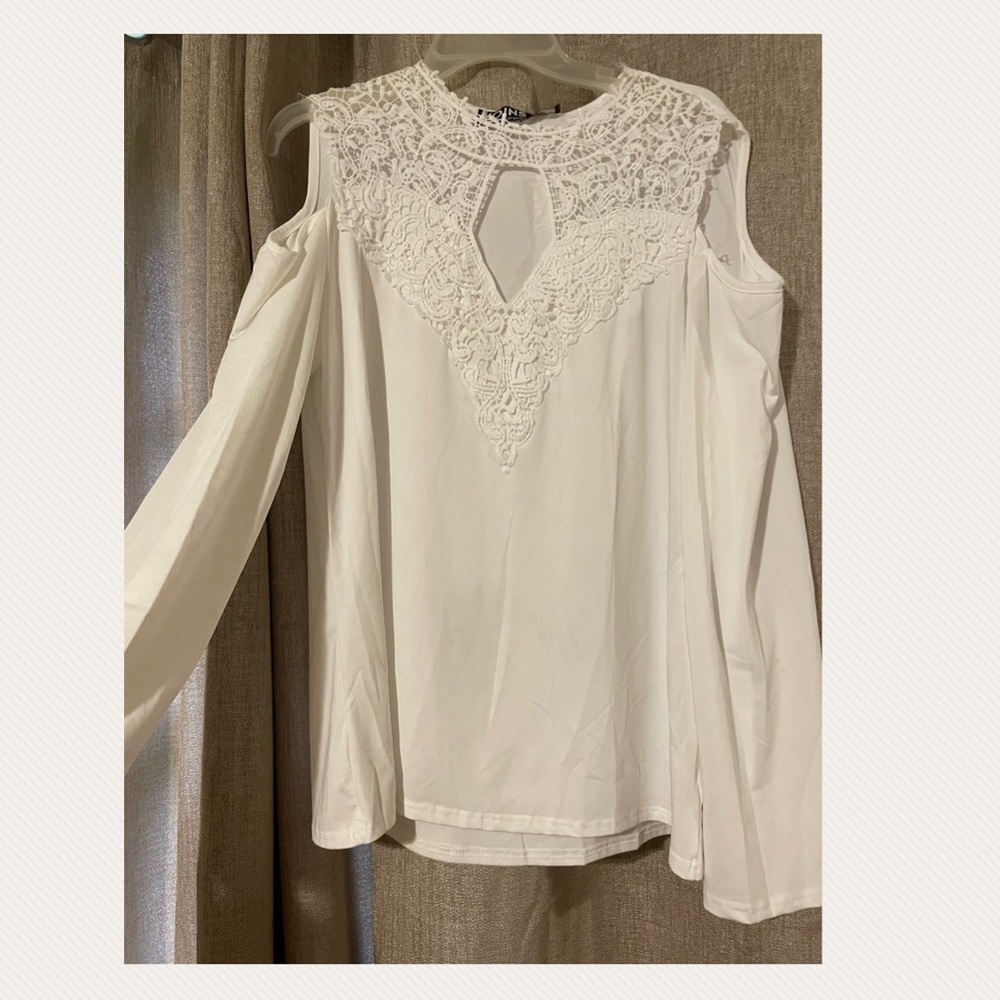 Very pretty shirt. New with tags. Picture doesn’t do it justice.